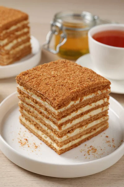 Delicious Layered Honey Cake Served Tea Wooden Table Closeup — Foto de Stock