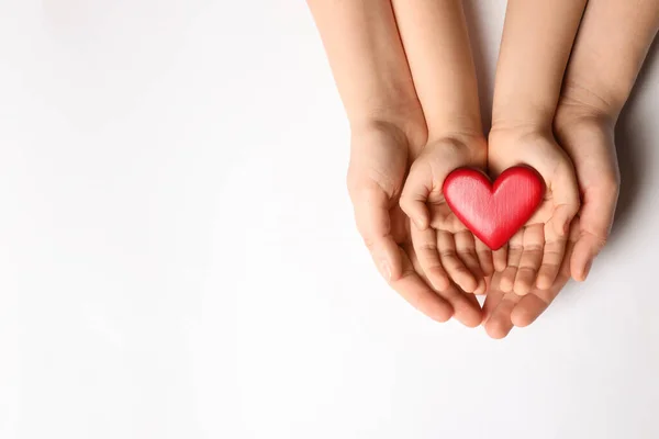 Woman Kid Holding Red Heart Hands White Background Top View — стоковое фото