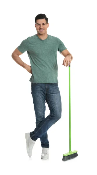 白底绿色扫帚的男人 — 图库照片
