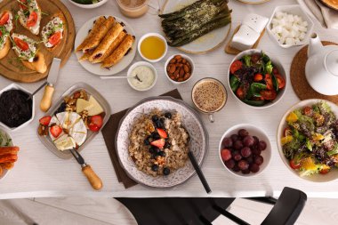 Many different dishes served on buffet table for brunch, flat lay