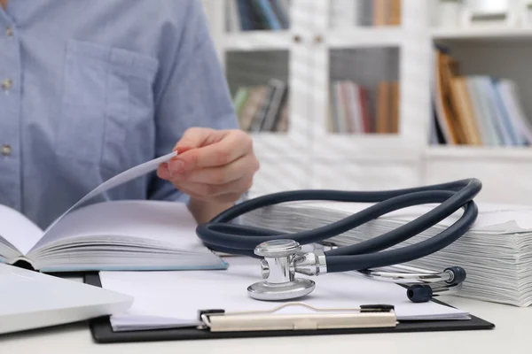 Woman Book Stethoscope Clipboard White Table Indoors Closeup Medical Education — Photo