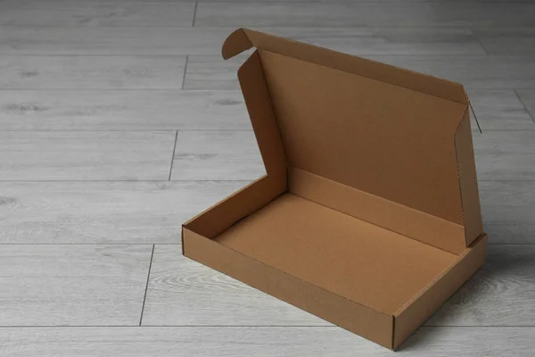 Empty Open Cardboard Box Floor Space Text — Stock Photo, Image