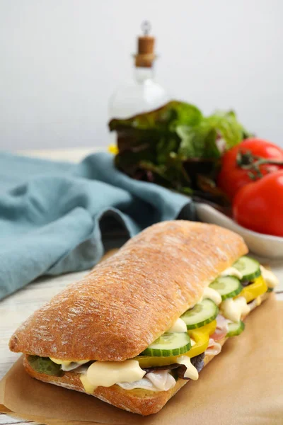 Delicious Sandwich Vegetables Ham Mayonnaise Parchment Paper Closeup — Stockfoto