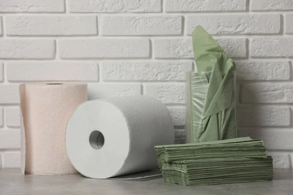 Different Paper Towels Napkins Grey Table White Brick Wall — Φωτογραφία Αρχείου