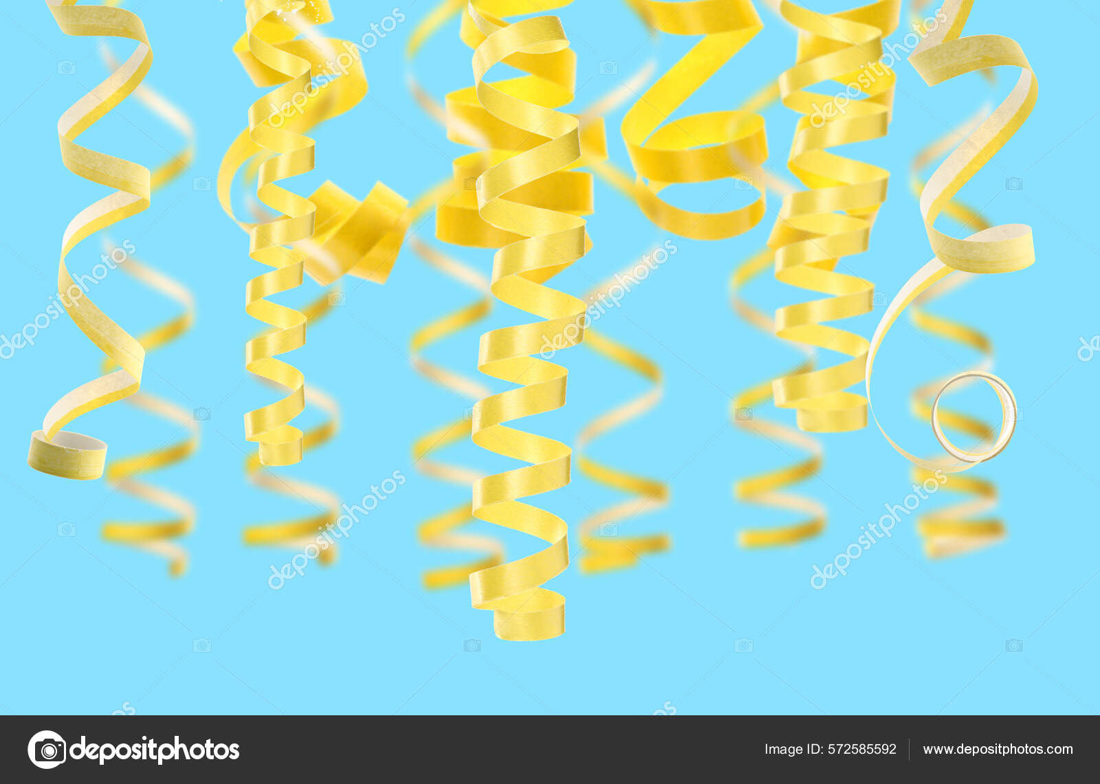 Many Yellow Serpentine Streamers Light Blue Background Party Decor Stock  Photo by ©NewAfrica 572585592