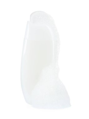 Bir şişe köpük banyosu ve beyaz köpük.