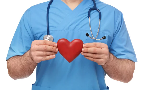 医生与听诊器和红心白色背景 心脏科概念 — 图库照片
