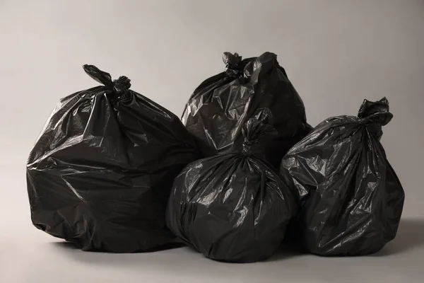 Trash Bags Full Garbage Grey Background — Stok fotoğraf