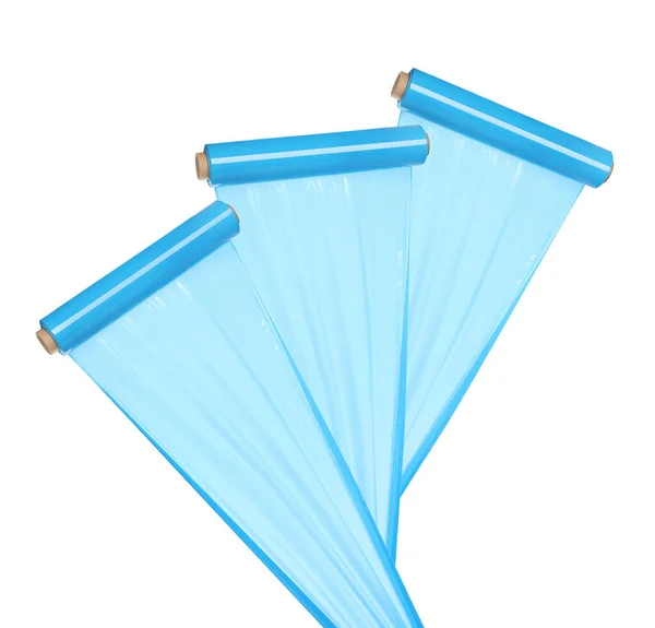 Rolls of turquoise plastic stretch wrap on white background