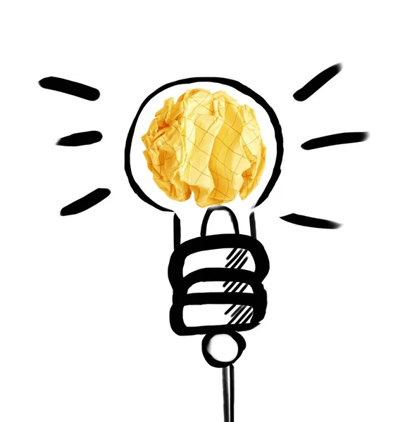 黄色の紙玉と白地に電球を描いた — ストック写真