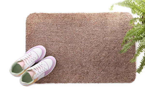 Stylish Door Mat Shoes Plant White Background Top View — Stock Photo, Image