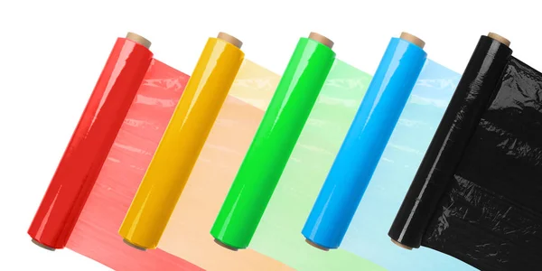 Rolls of colorful plastic stretch wrap on white background. Banner design