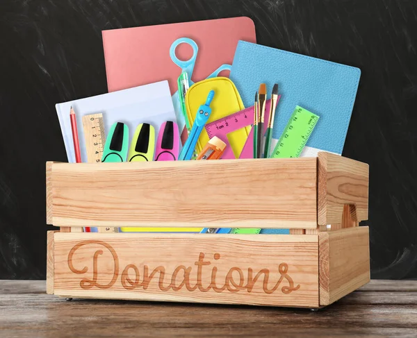 Donation Box Different School Stationery Wooden Table Blackboard — Φωτογραφία Αρχείου