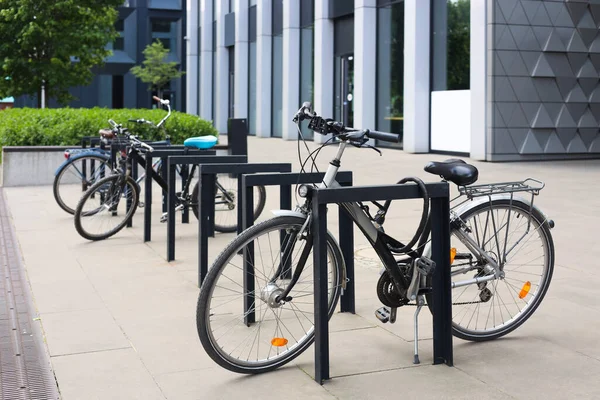 Bicycles locked to stands on city street