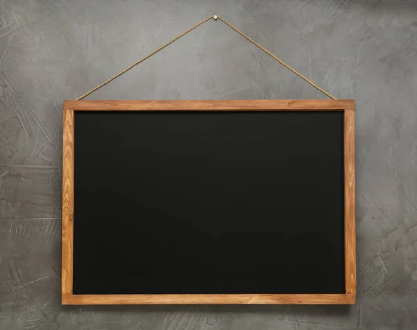 Clean Black Chalkboard Hanging Grey Wall — Stock Photo, Image