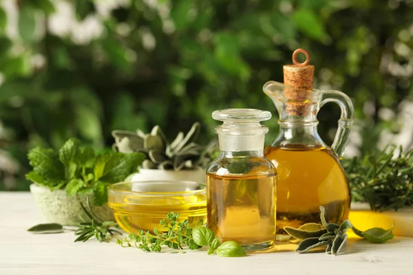 Diferentes Hierbas Frescas Con Aceites Mesa Madera Blanca —  Fotos de Stock