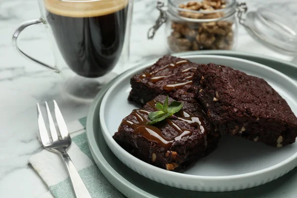 Delicious Chocolate Brownies Nuts Caramel Sauce Fresh Mint White Marble — Stock Photo, Image