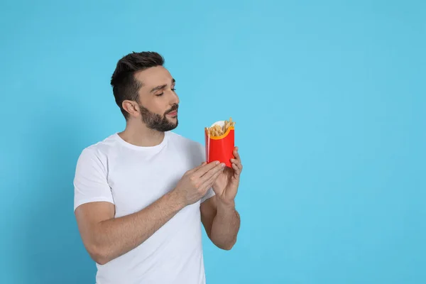 Man French Fries Light Blue Background Space Text — Stock Photo, Image