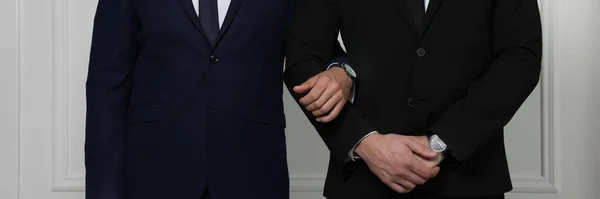 Gay Couple Elegant Suits Standing White Wall Closeup Banner Design — Stock Photo, Image