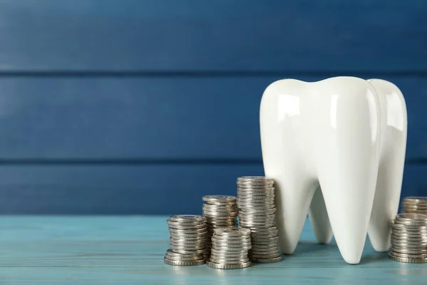 Ceramic Model Tooth Coins Light Blue Wooden Table Space Text — Stock Photo, Image