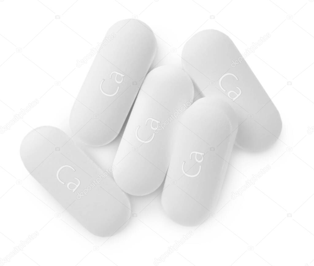 Pile of calcium supplement pills on white background, flat lay