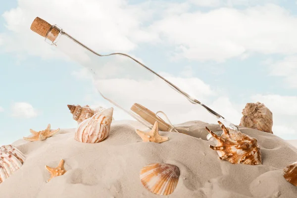 Corked Glass Bottle Rolled Paper Note Seashells Sand Sky — Stock Photo, Image