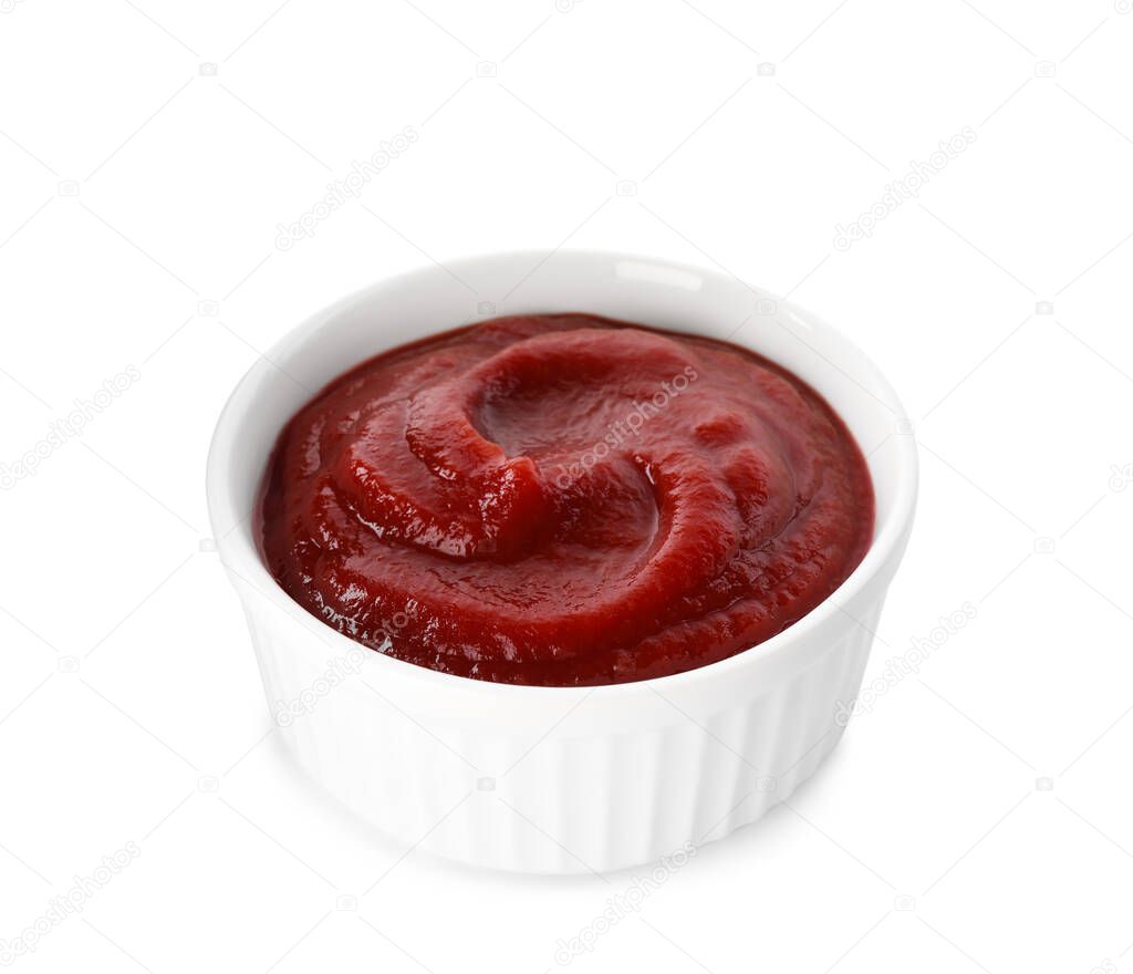 Tasty ketchup in bowl isolated on white, closeup