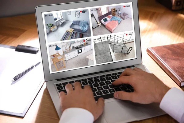 Man Monitoring Modern Cctv Cameras Wooden Table Closeup Smart Home — Stock Photo, Image