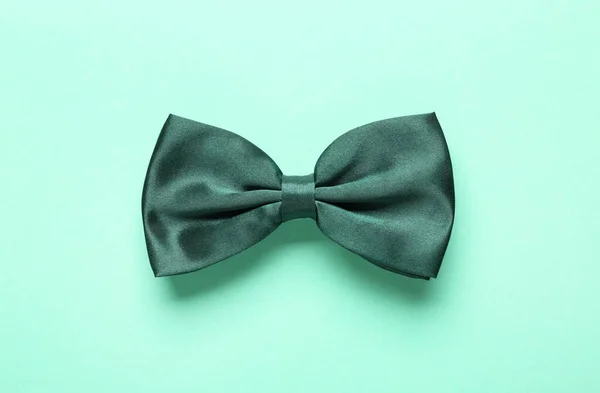 Stylish Satin Bow Tie Light Green Background Top View — Stock Photo, Image