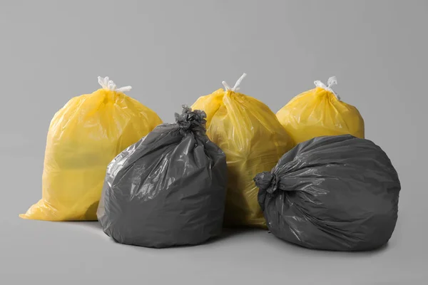 Trash Bags Full Garbage Grey Background — Stok fotoğraf