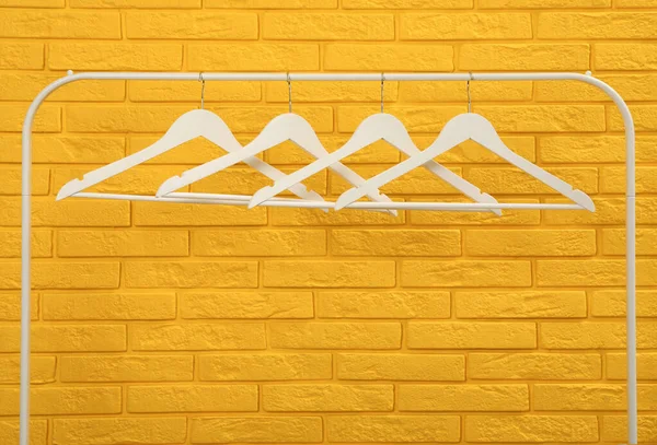 Wardrobe Rack Many Hangers Yellow Brick Wall — 스톡 사진