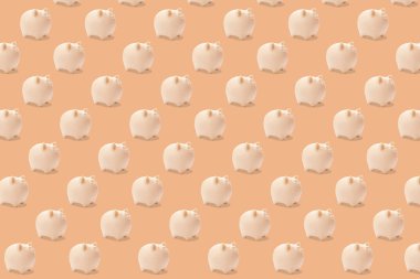 Açık turuncu arka planda parlak domuz kumbarası deseni