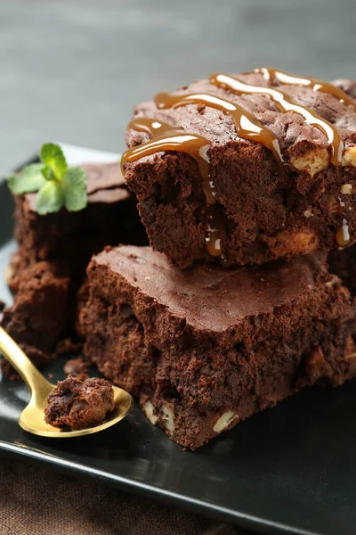 Delicious Chocolate Brownies Nuts Caramel Sauce Fresh Mint Plate Closeup — Stock Photo, Image