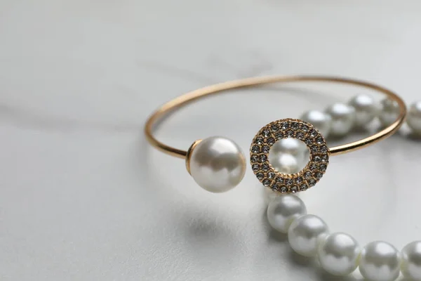 Elegant Bracelets Pearls White Marble Table Closeup — Stock Photo, Image