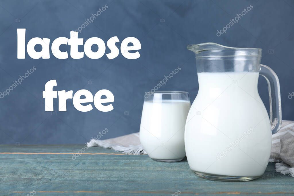 Fresh lactose free milk on blue wooden table