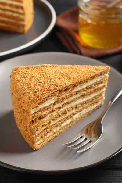 Slice Delicious Layered Honey Cake Served Black Wooden Table Closeup — Stockfoto