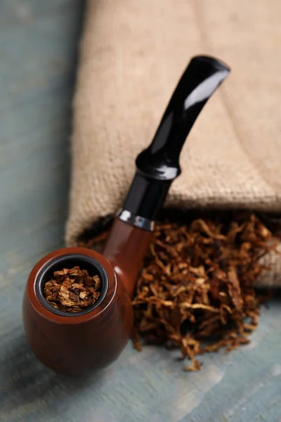 Smoking Pipe Dry Tobacco Sackcloth Blue Wooden Table Closeup — Stockfoto