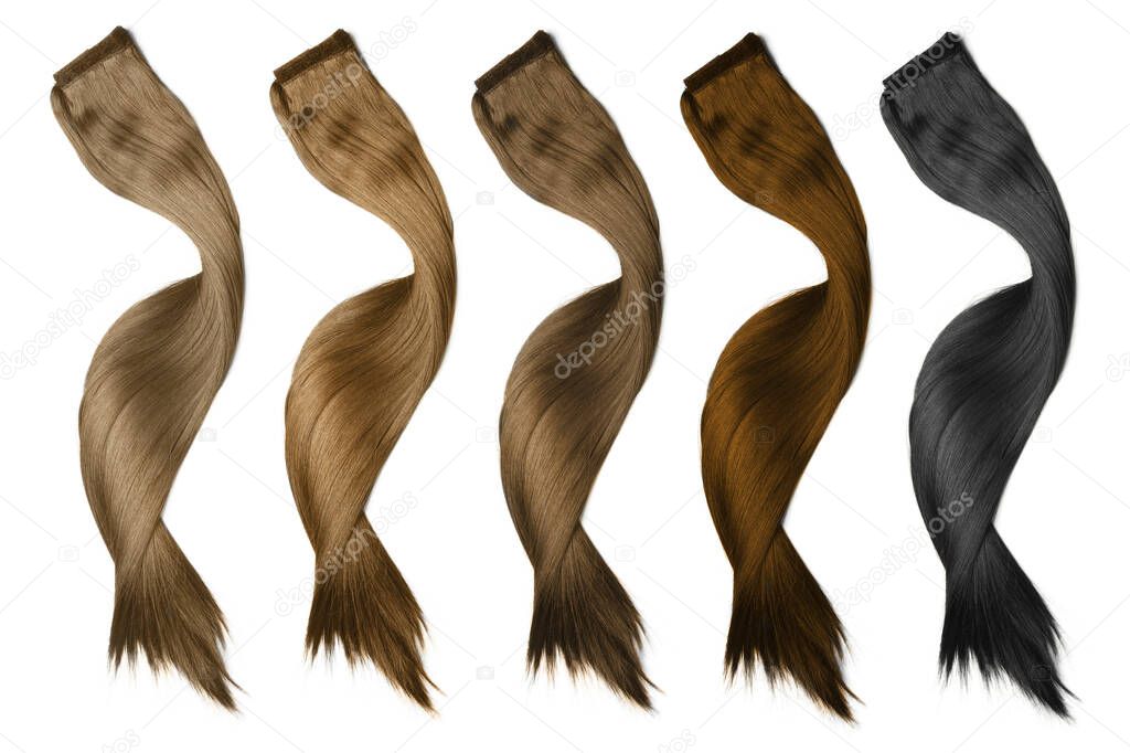 Strands of different beautiful hair on white background, top view