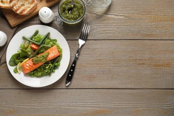 Tasty Cooked Salmon Pesto Sauce Served Wooden Table Flat Lay — Stockfoto