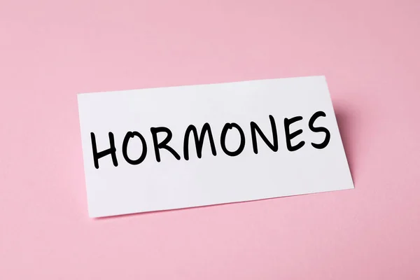 Sheet Paper Word Hormones Pink Background — Stock Photo, Image