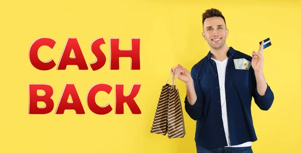 Happy man with money, shopping bags, credit card words Cash Back on yellow background. Banner design