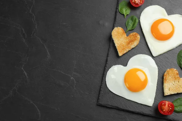 Heart Shaped Fried Eggs Toasts Black Table Top View Space — Foto de Stock