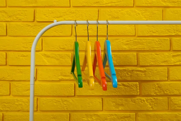 Wardrobe Rack Many Hangers Yellow Brick Wall — Stok Foto