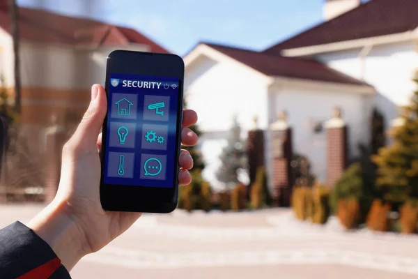 Woman Using Home Security App Smartphone Outdoors Closeup — Stock Photo, Image