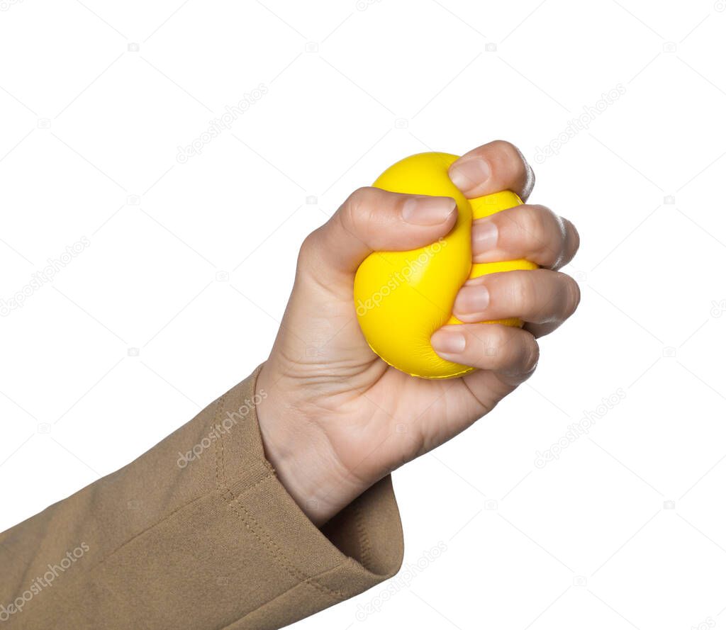 Woman squeezing antistress ball on white background, closeup