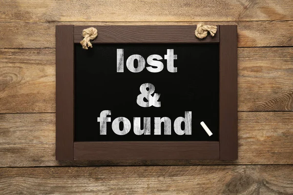 Phrase Lost Found Written Blackboard Wooden Table Top View — ストック写真