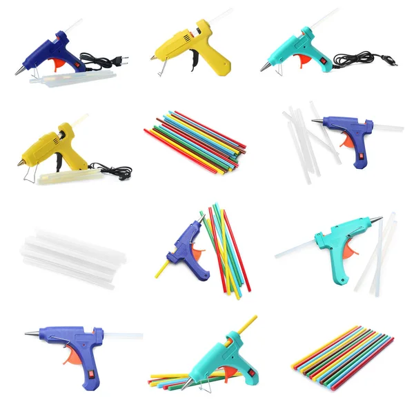 Set with different glue guns with sticks on white background