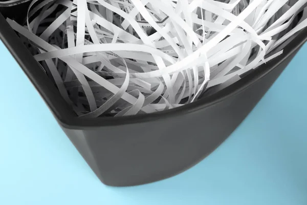 Shredded Paper Strips Trash Bin Light Blue Background Closeup — Stock Photo, Image
