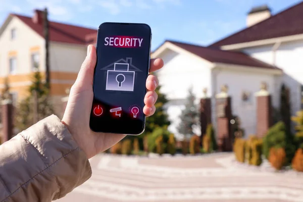 Woman Using Home Security App Smartphone Outdoors Closeup — Stock Photo, Image