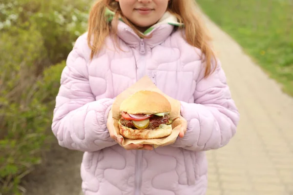 Little Girl Holding Fresh Delicious Burger Outdoors Closeup Street Food — 스톡 사진